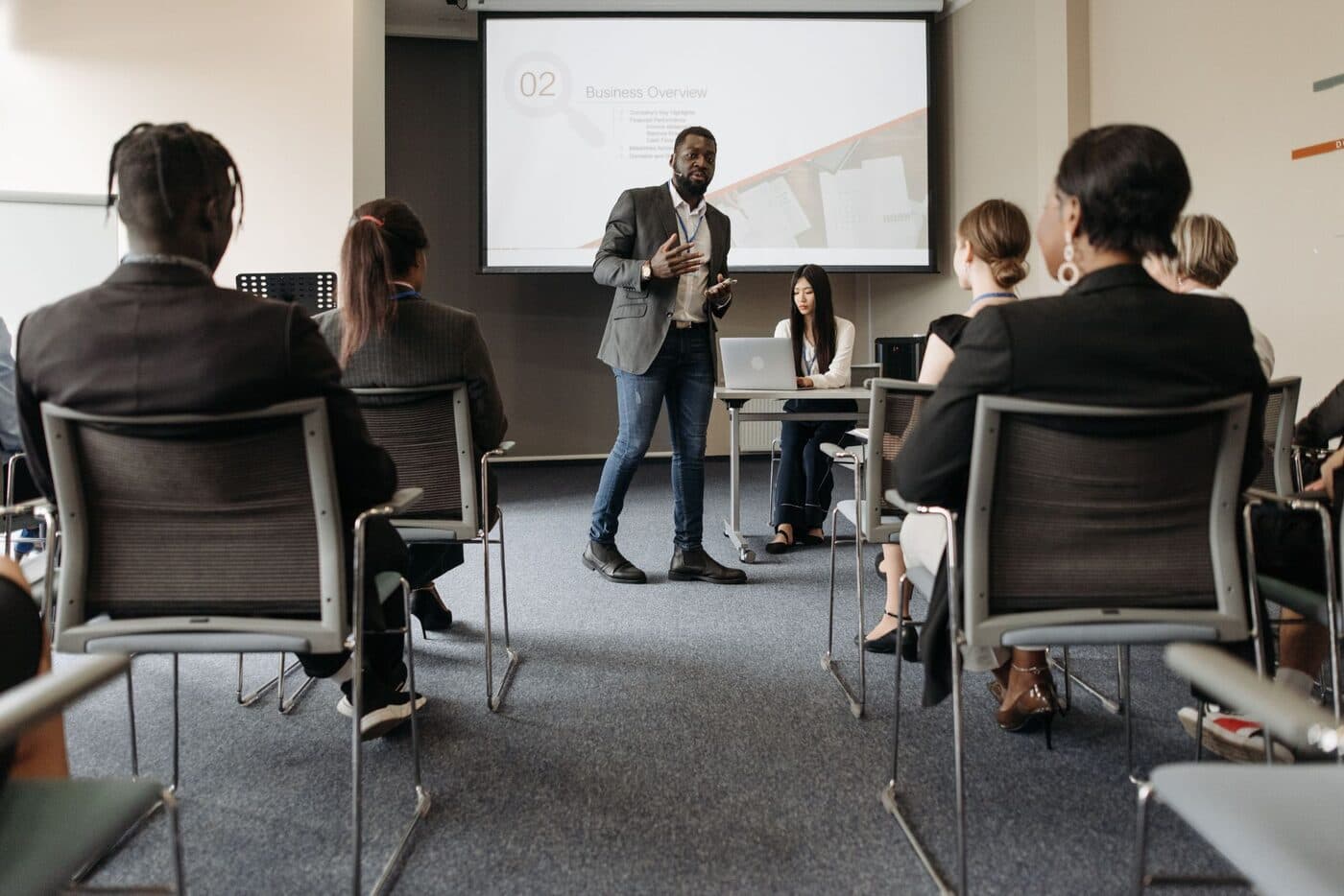 An executive presenting to a room of colleagues